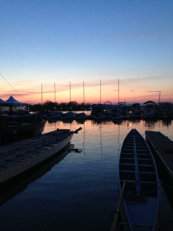 empty dragon boats at sunset