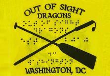 Out of Sight Dragons written in English and brail with a paddle and white cane crossing